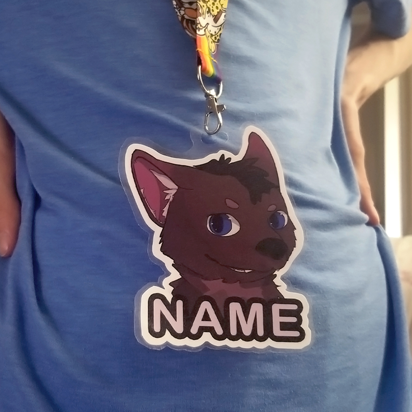 Printed and laminated version of artwork being worn with a lanyard.